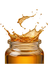 A close-up of golden liquid splashing out of a glass jar against a white background, with droplets and waves frozen in mid-air.