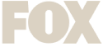 The image shows the word FOX in large, bold, light beige capital letters on a white background.