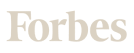 The image shows the word Forbes in a light beige serif font on a light background.